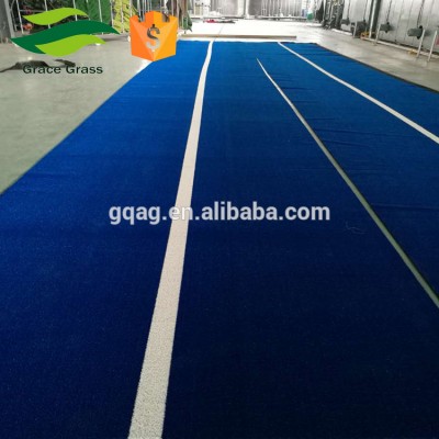 Artificial grass for durable sports flooring-gym training sled